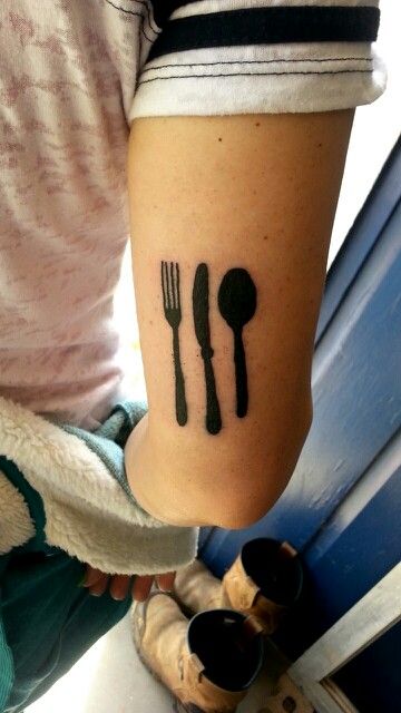 Nice Fork And Spoon With Knife Silhouette Tattoo Design On Triceps