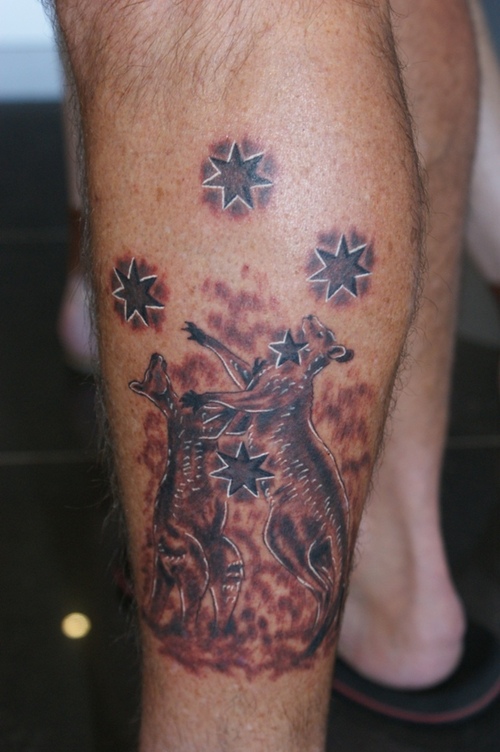 Nice Grey And Black Kangaroos With Stars Tattoo On Leg