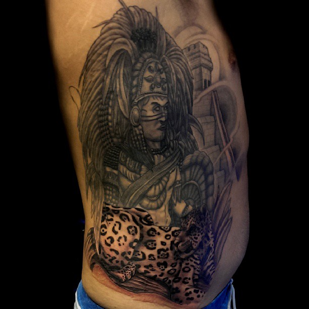 Nice Grey Ink Aztec Warrior And Jaguar Tattoo On Side Rib For Men