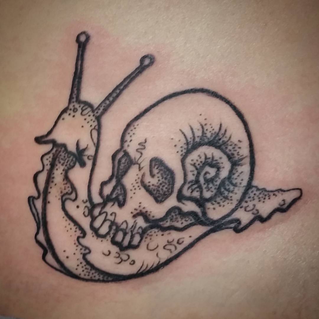 Nice Grey Skull On Snail Back Tattoo
