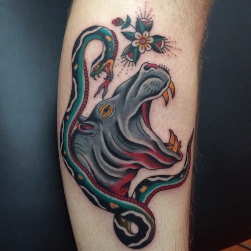 Nice Hippo Vs Snake Traditional Tattoo On Arm Sleeve