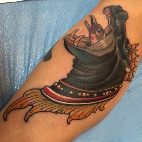 Nice Penguin Head In Hippo Mouth Tattoo
