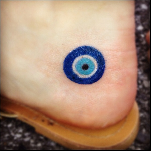 Nice Small Blue Evil Eye Tattoo On Heel
