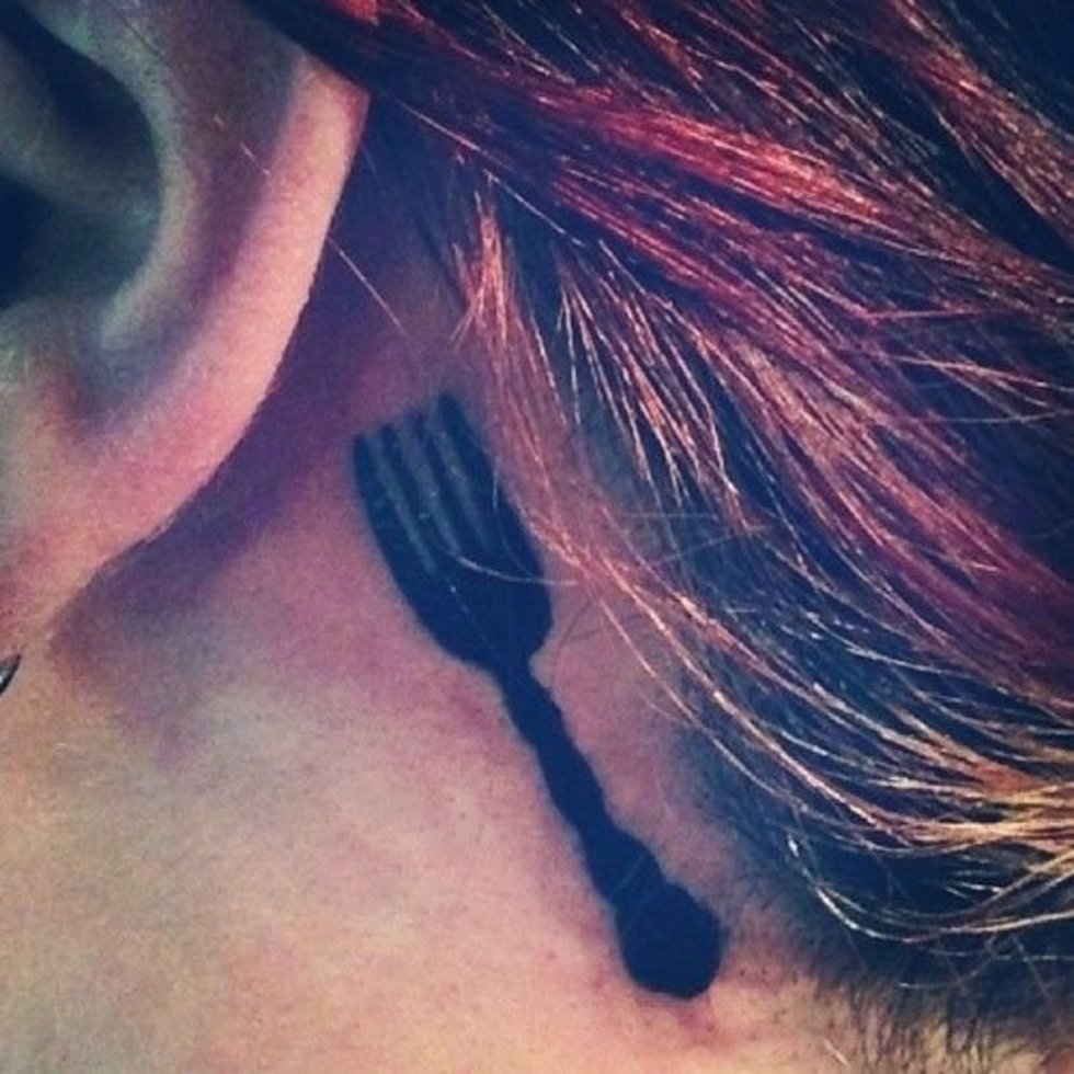 Nice Small Fork Silhouette Tattoo On Behind Ear