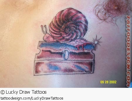 Nice Snail On Cake Piece Tattoo Sample