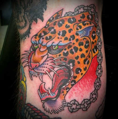 Nice Traditional Angry Jaguar Head Tattoo On Half Sleeve