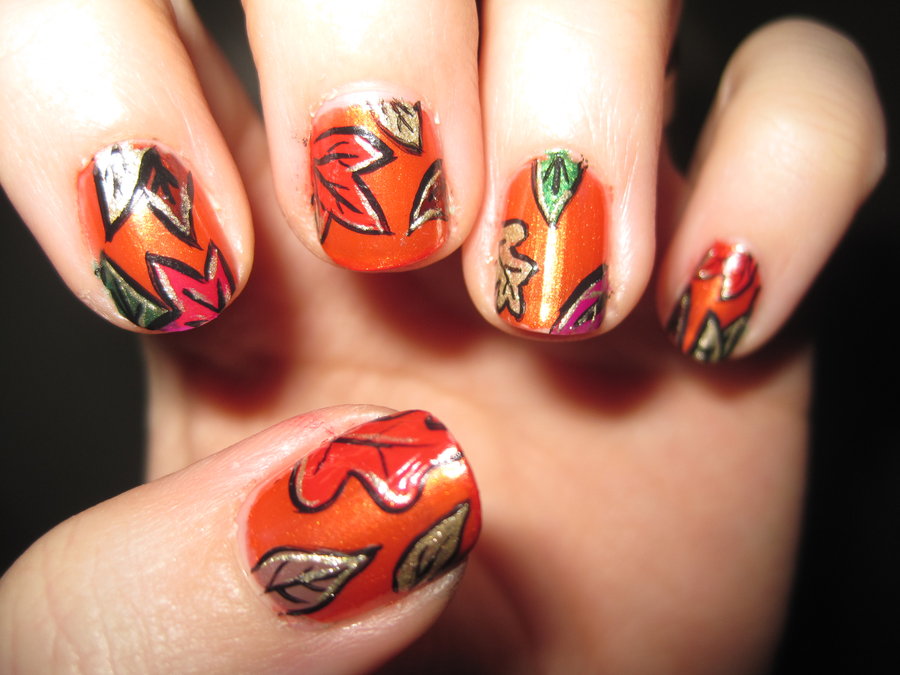 Orange Base Nails With Autumn Leaves Nail Art