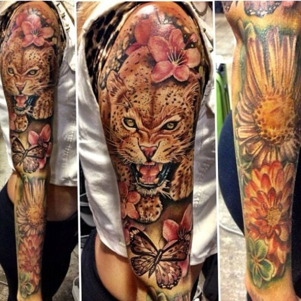 Outstanding Angry Jaguar With Flowers And Butterfly Colored Tattoo On Full Sleeve