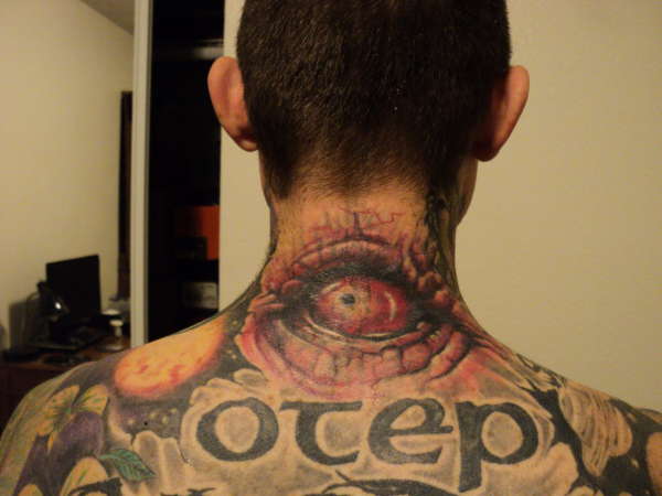 Outstanding Evil Eye With Otep Word Tattoo On Nape