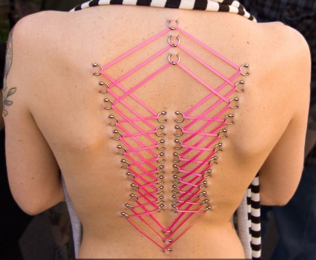 Pink Ribbon Corset Piercing On Girl Back