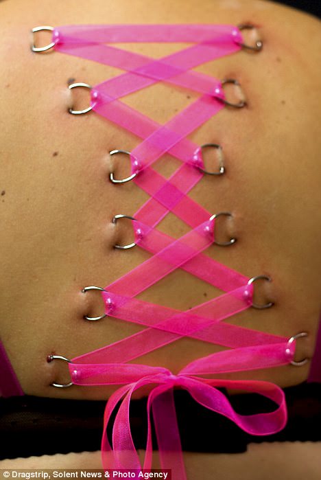 Pink Ribbon Corset Piercing On Girl Upper Back