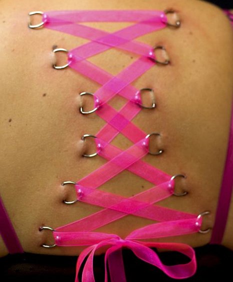 Pink Ribbon Corset Piercing On Upper Back