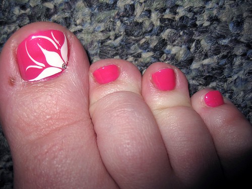 Pink Toe Nail Art With White Flower Design