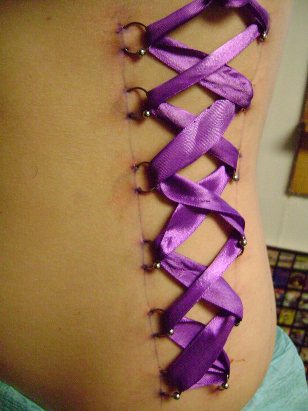 Purple Ribbon Corset Piercing on Girl Back