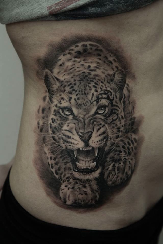 Realistic Angry Jaguar Walking Tattoo On Side Rib