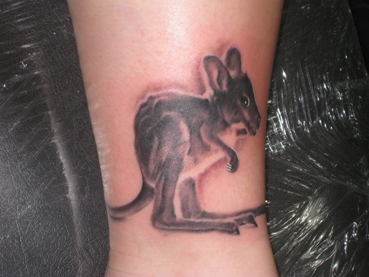Realistic Colored Baby Kangaroo Tattoo
