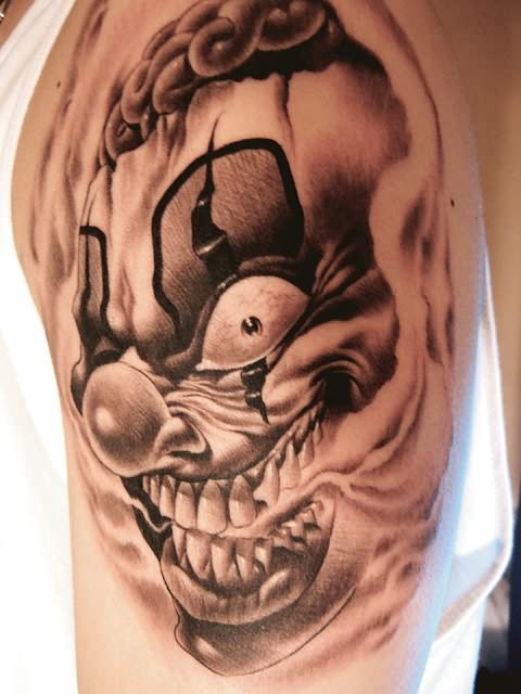 Realistic Colored Evil Clown Face Tattoo On Left Half Sleeve