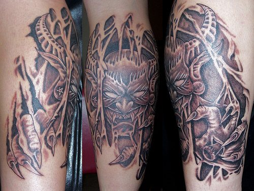 Realistic Colored Evil Ripped Skin Tattoo