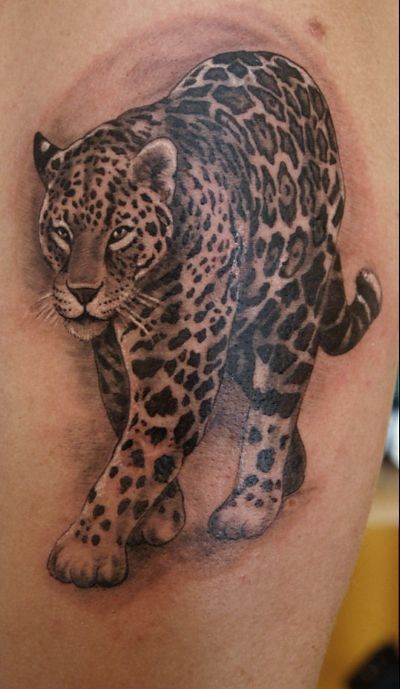 Realistic Colored Jaguar Walking Tattoo