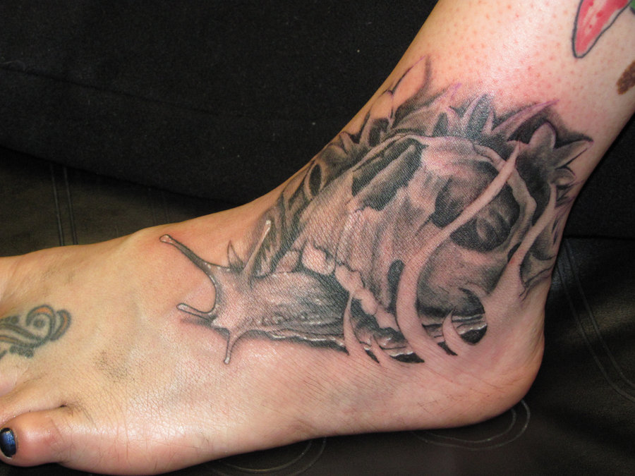 Realistic Colored Snail With Skull Tattoo On Foot By Johnnyjinx