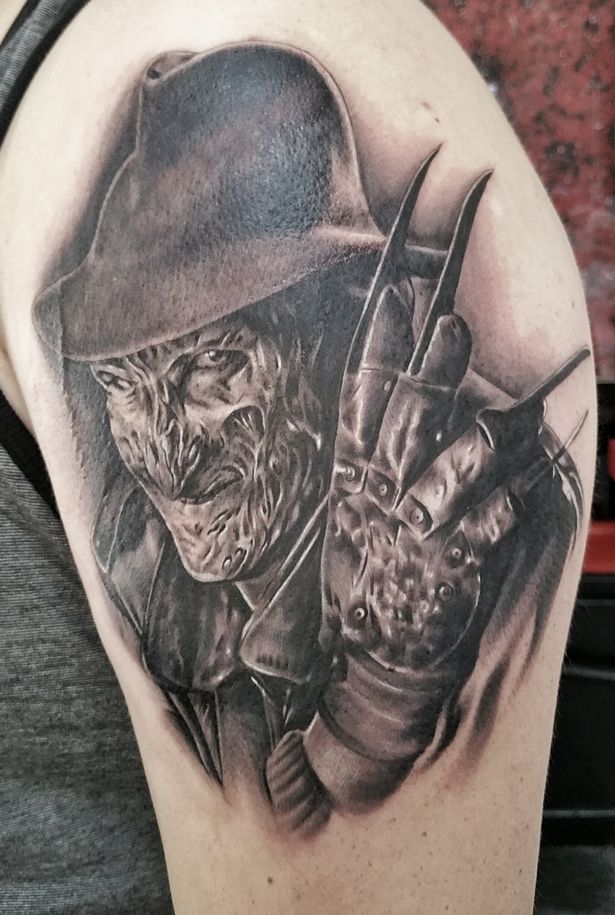 Realistic Grey Ink Freddy Tattoo On Left Shoulder