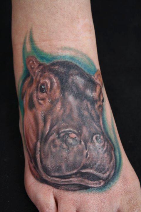 Realistic Grey Ink Hippo Head Tattoo On Foot
