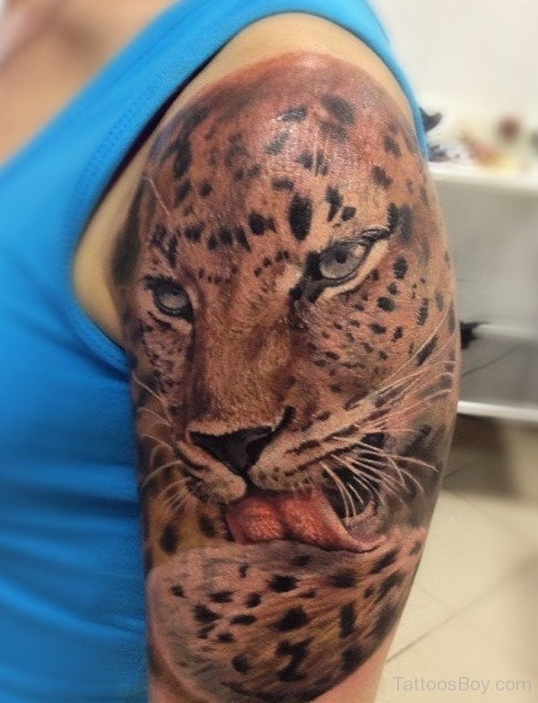 Realistic Jaguar Cleaning Body Tattoo On Left Half Sleeve