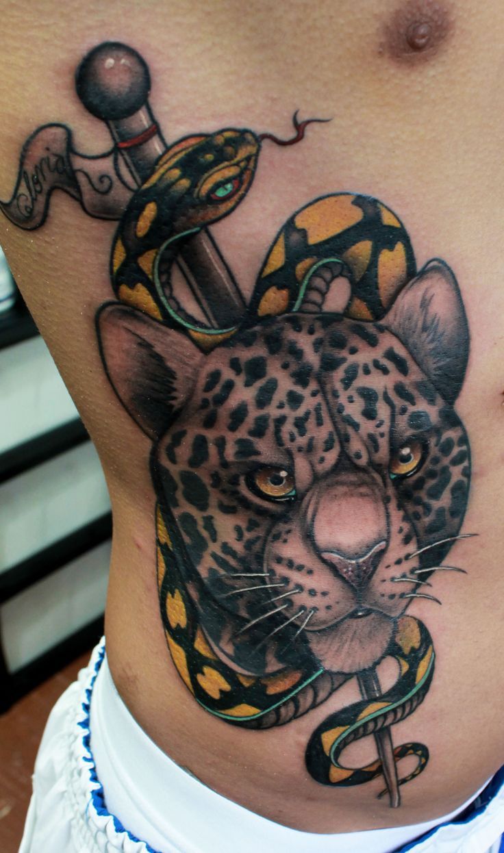 Realistic Jaguar Face With Snake Traditional Tattoo On Side Rib