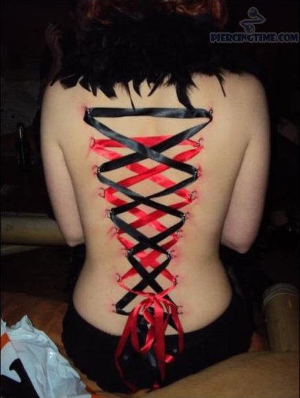 Red And Black Corset Piercing On Girl Back