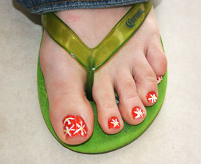 Red Base Nails With White Flowers Toe Nail Art