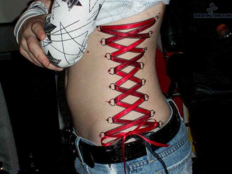 Red Corset Piercing On Girl Side Rib