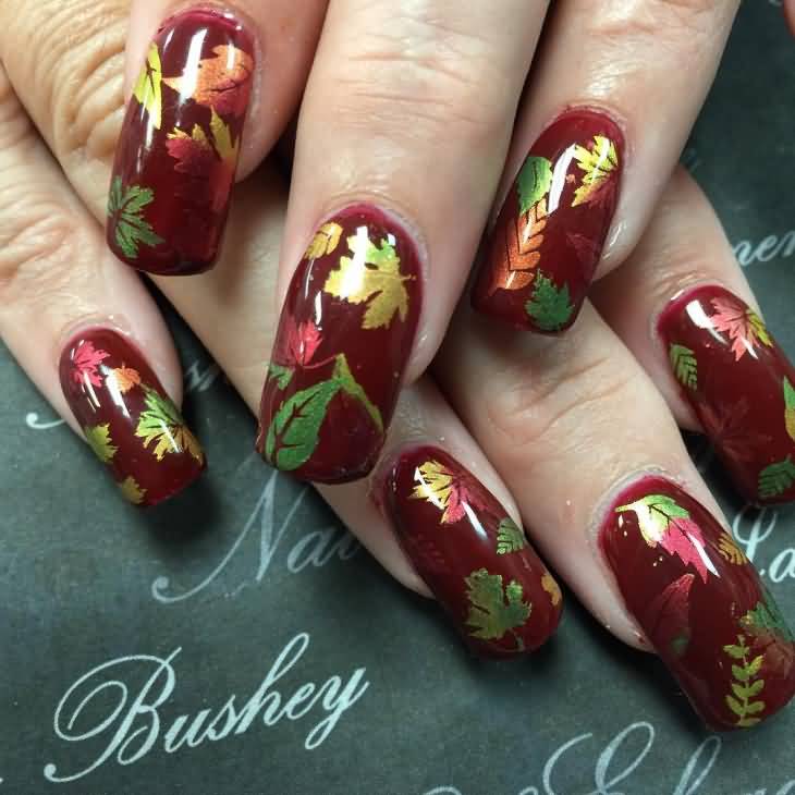 Red Nails With Autumn Leaves Nail Art Idea