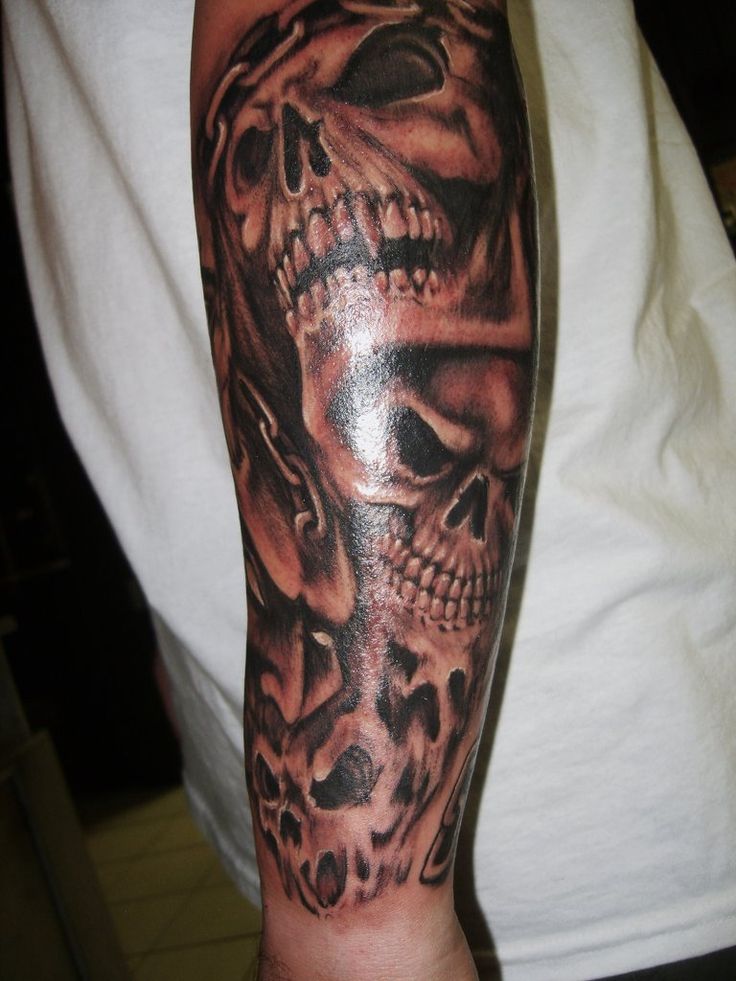 Scary Grey And Black Evil Skulls Tattoo On Arm Sleeve