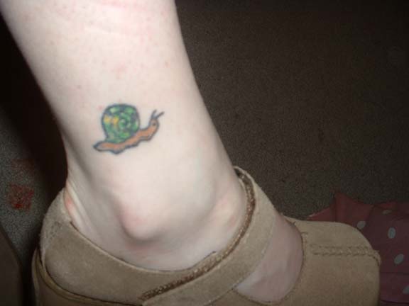Simple And Small Snail Tattoo On Ankle