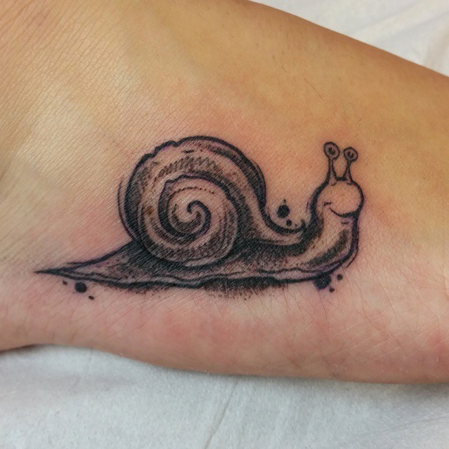 Simple Grey Ink Smiling Snail Tattoo