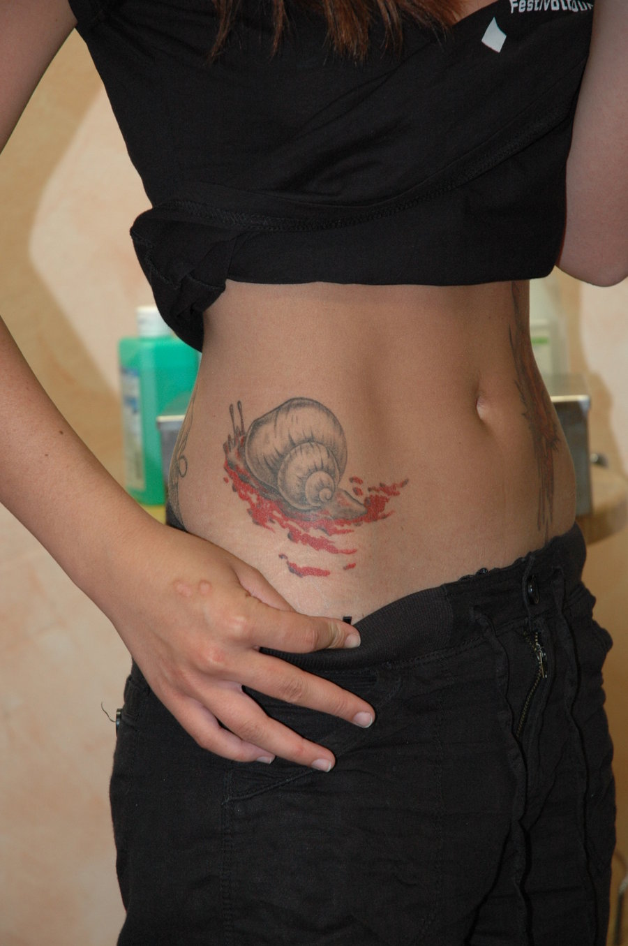 Simple Snail With Blood Tattoo On Side Rib