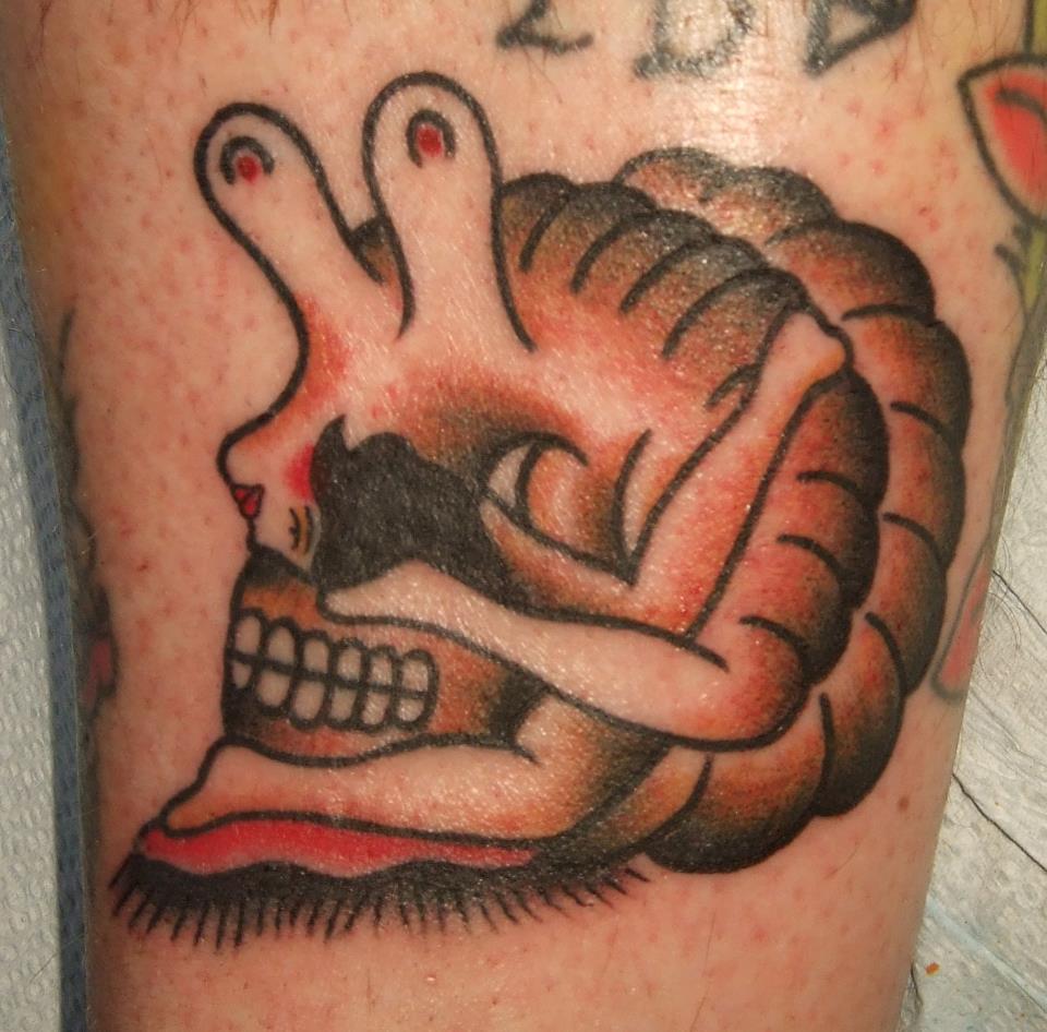 Skull And Snail Traditional Tattoo