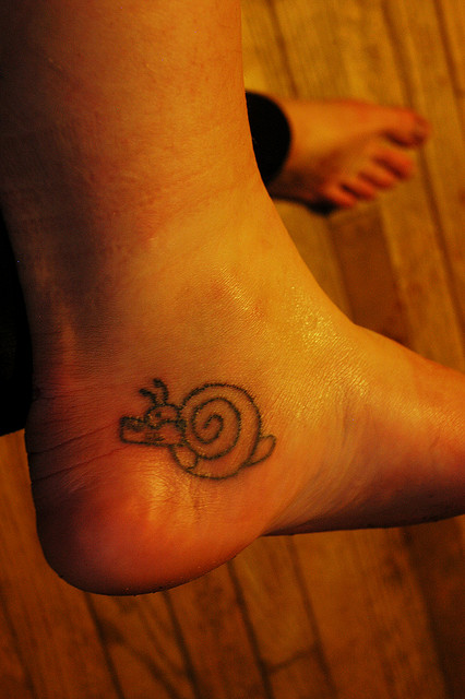 Small Cute Snail Tattoo On Heel