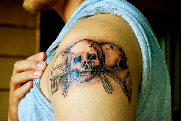 Small Grey Ink Evil Skulls Tattoo On Left Shoulder