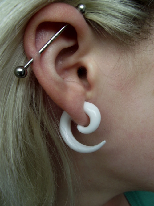 Spike Lobe And Industrial Piercing On Girl Right Ear