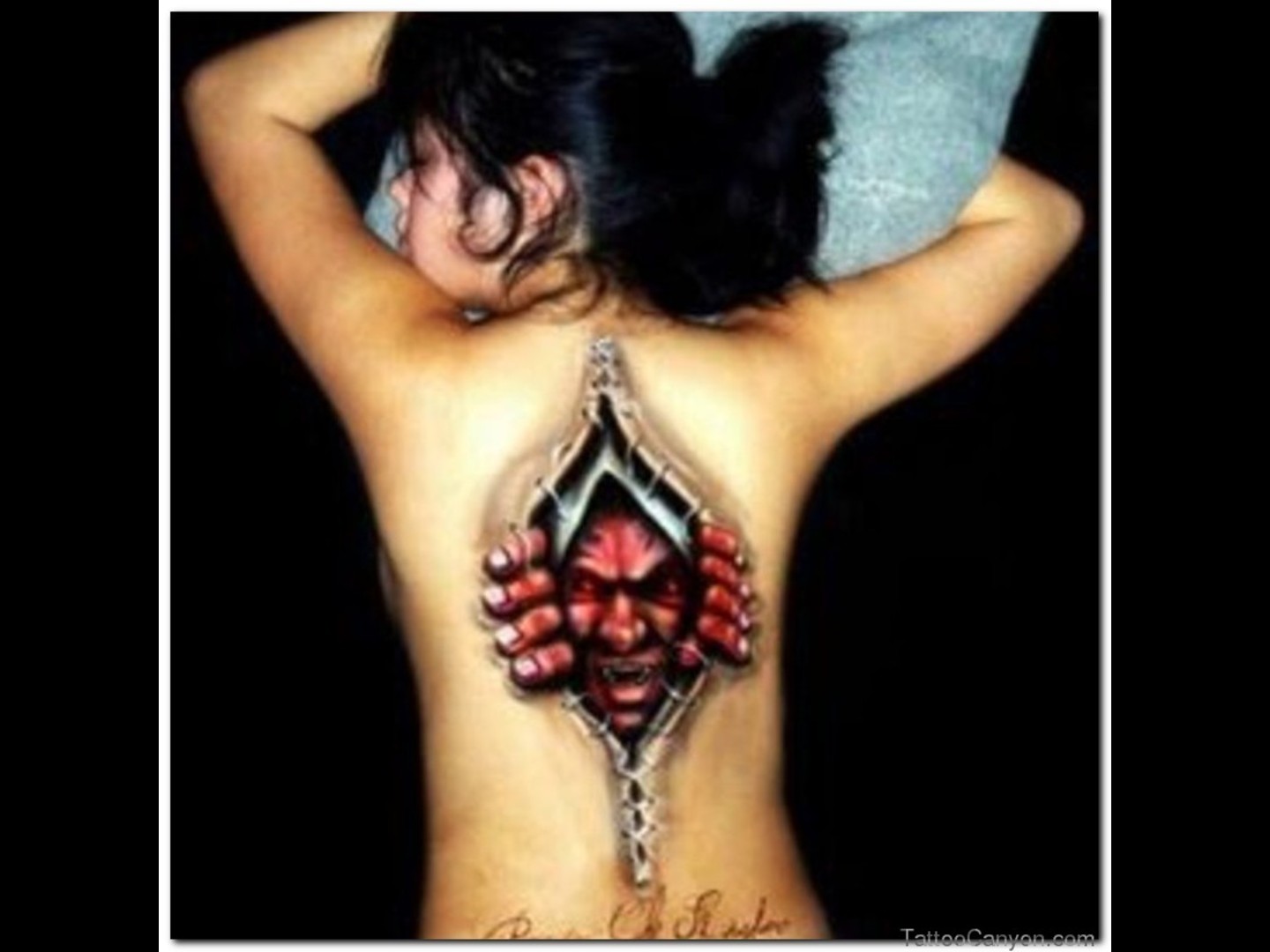 Superb Evil Ripped Skin Tattoo On Full Back