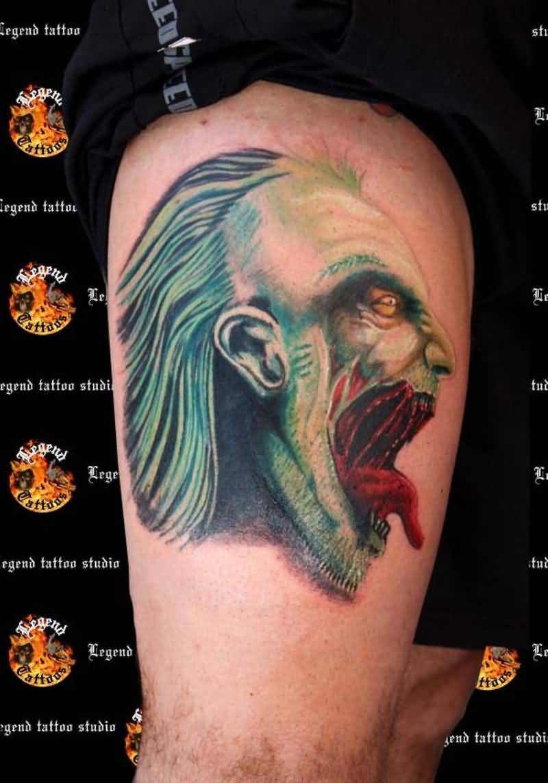Terrific Evil Face Showing Tongue Tattoo