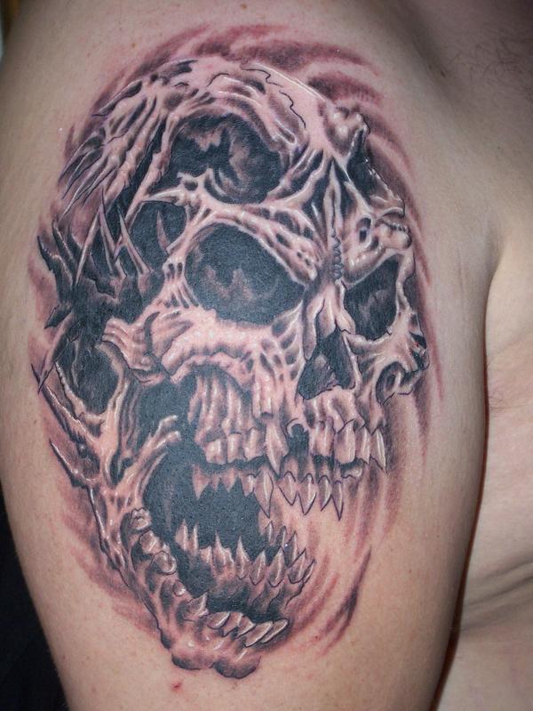 Terrific Grey Angry Evil Skull Tattoo On Right Shoulder