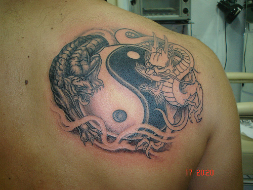 Terrific Yin Yang And Good Vs Evil Tattoo On Right Back Shoulder