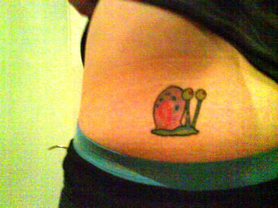 Tiny And Cute Gary The Snail Tattoo On Lower Back