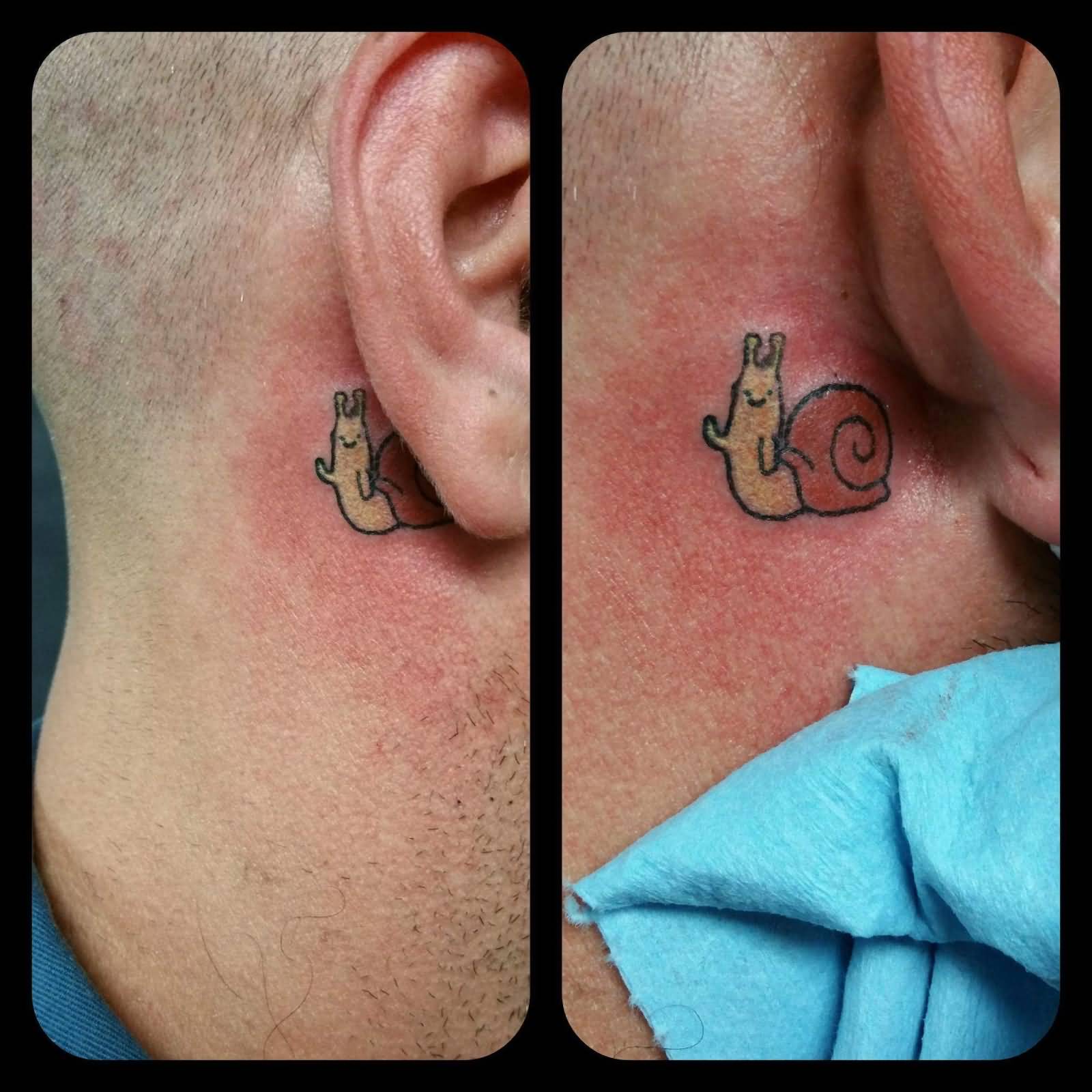 Tiny And Cute Snail Tattoo On Behind Ear