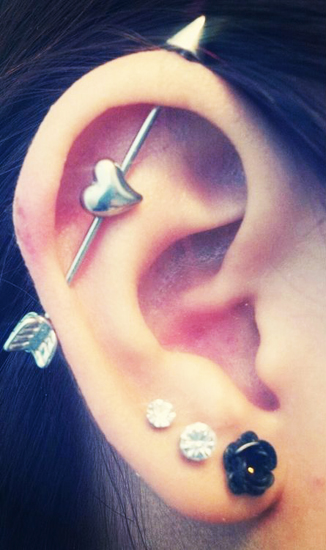 Triple Ear Lobe And Industrial Piercing With Arrow Barbell