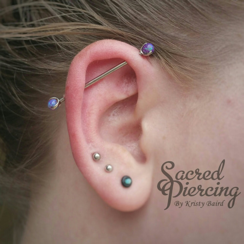 Triple Lobes And Industrial Piercing On Girl Right Ear