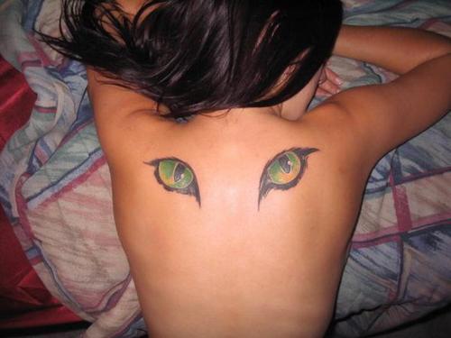 Two Evil Eyes Tattoo On Upper Back