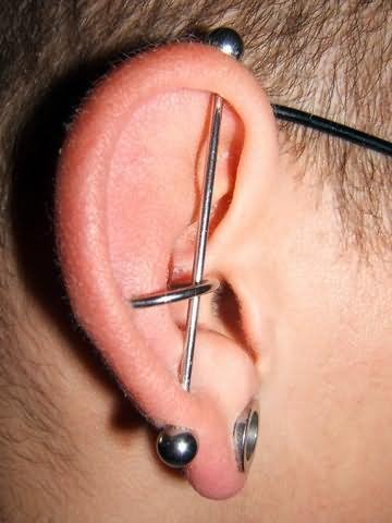 Vertical Industrial Piercing On Girl Right Ear